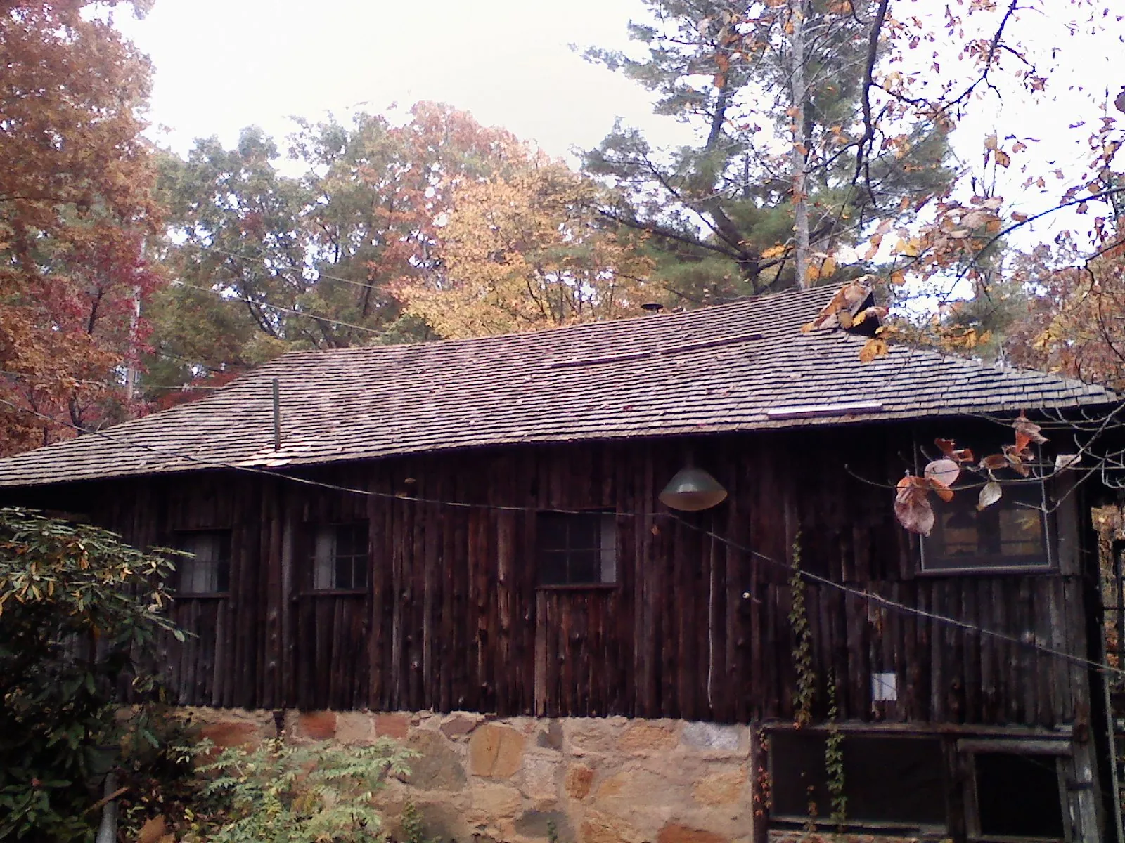 Weathered wood shake roof on a rustic board sided cabin in Moscow